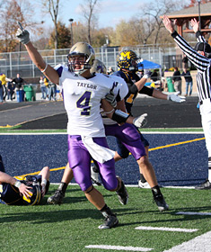 Taylor's Ryan Magnuson celebrates after catching his sixth touchdown of the game for game-winner in a 36-35 win over Marian.
